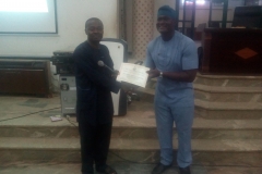 THE CHAIRMAN PRESENTING CERTIFICATE TO THE PRESENTER DURING ONE OF THE BRANCH OGM